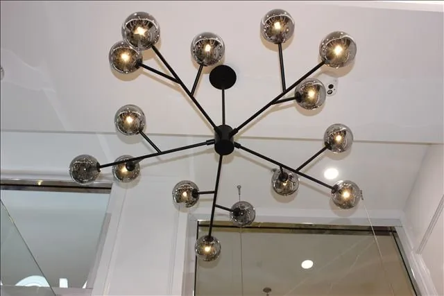 Feature globe chandelier installed in the Vogue Hair Bar salon